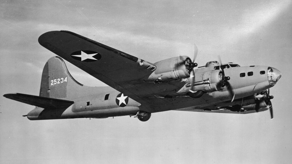 circa 1942: A U.S. Air Force B-17 'Flying Fortress' bomber flies through the sky, World War II. The aircraft was used extensively in Allied air raids, such as those against Hamburg and Dresden, and battles against German aircraft. (Photo by R. Gates/Hulton Archive/Getty Images)