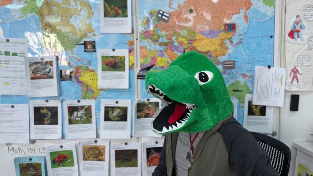 Why Is This Teacher Wearing a Dinosaur Head? dinosaur teacher