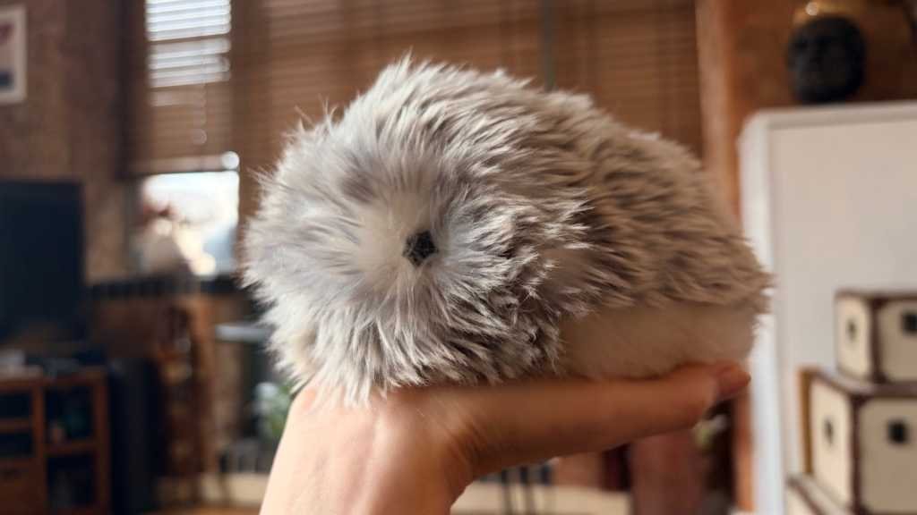 Casio’s AI Pet Moflin Review Moflin seated on an open palm